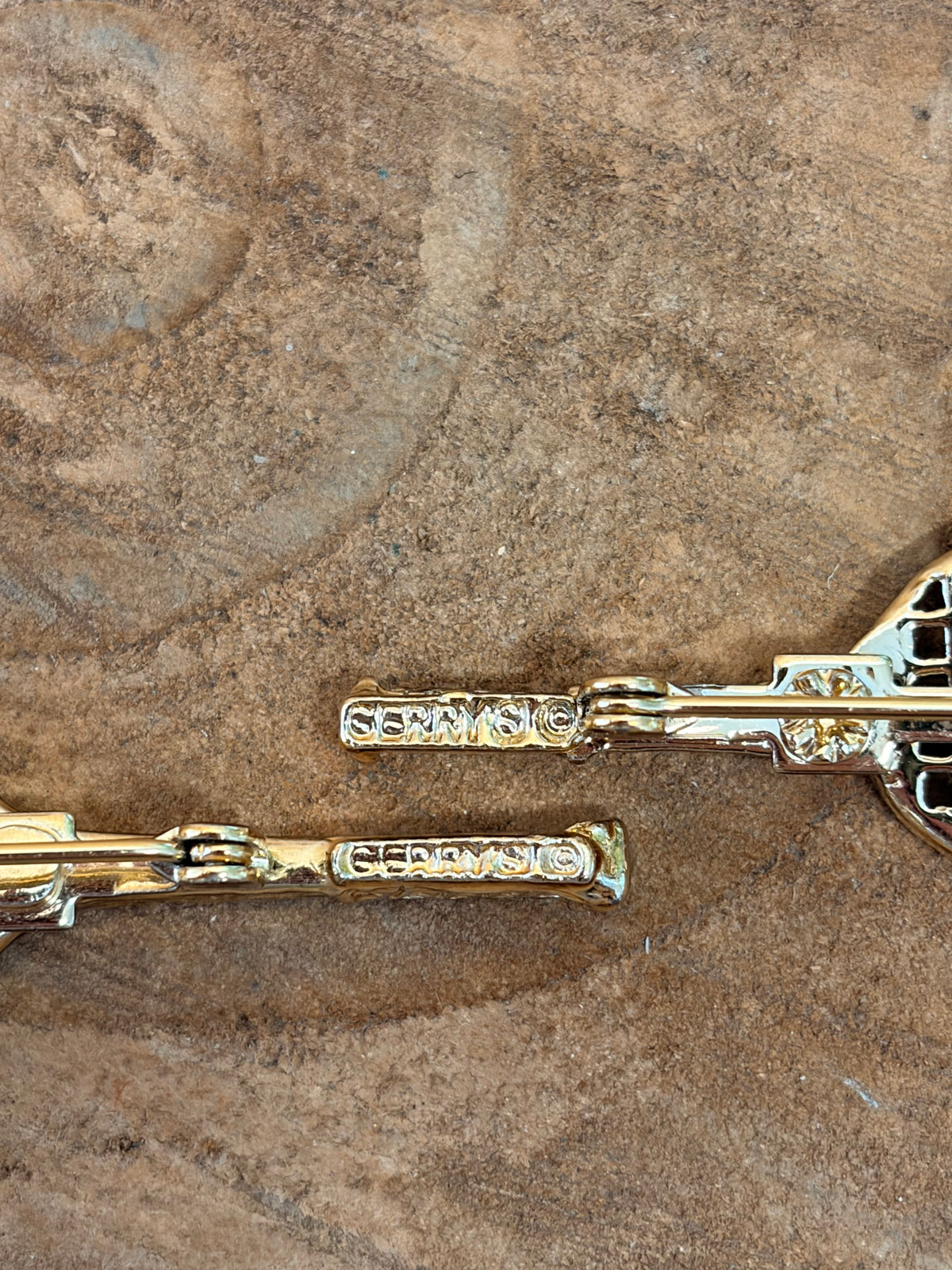 Pair of Gold Tone Tennis Brooches