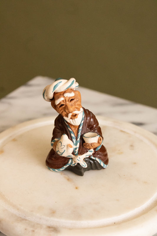 Small Sitting Man